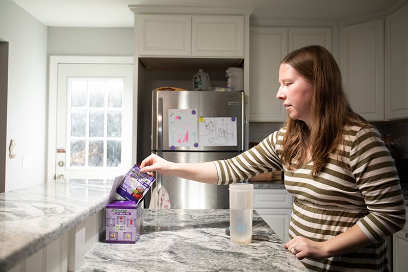 Woman getting ready to mix GMP-based formula