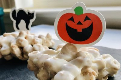 Halloween treats with pumpkin and cat decorations