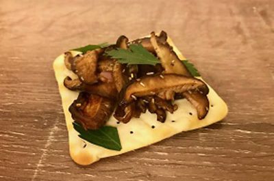 Mushroom bruschetta on a cracker