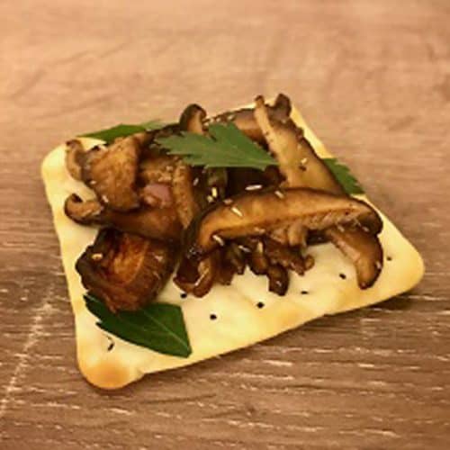 Mushroom bruschetta on a cracker