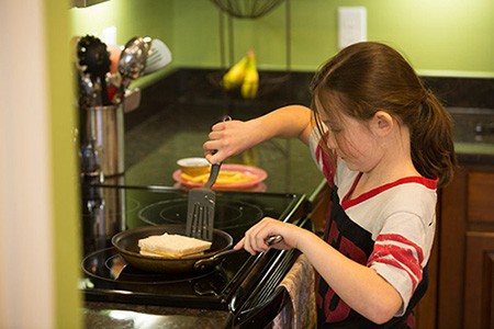 Young girl cooking