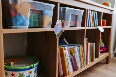 bookshelf with books and toys at daycare