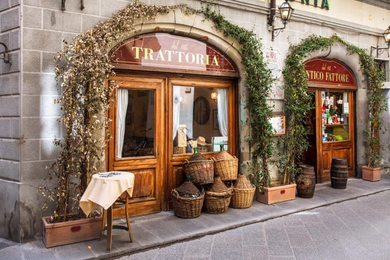 view of trattoria door with baskets piled beside it
