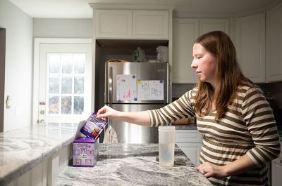 Woman getting ready to mix GMP-based formula